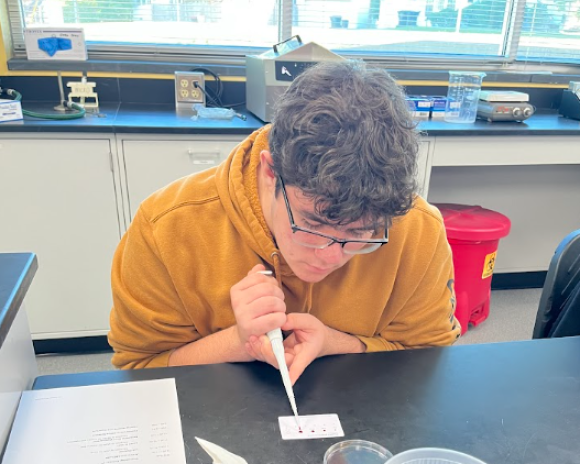 student doing pipette art