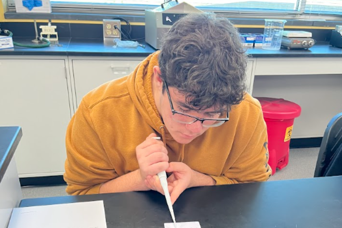 student doing pipette art